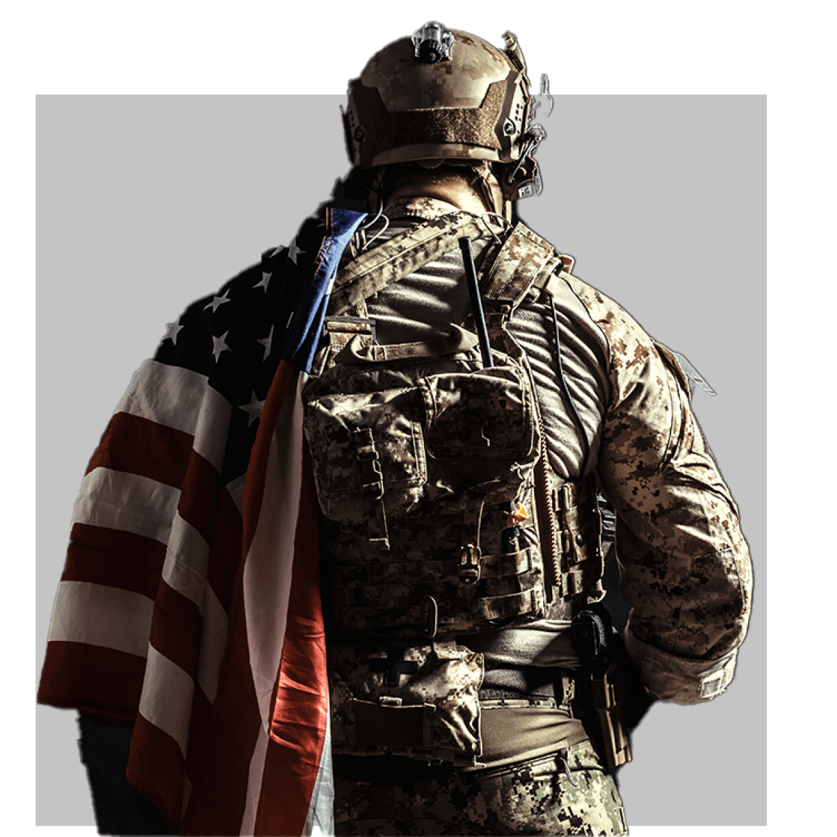 Military soldier in combat gear with American flag, facing away, on gray background - 88 characters